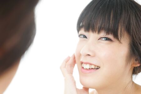 Young woman doing skin careの写真素材