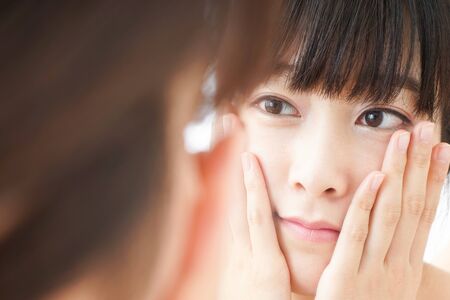 Young woman doing skin careの写真素材