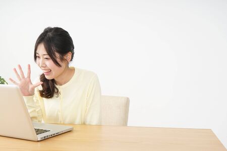 Young woman making a video phone callの写真素材