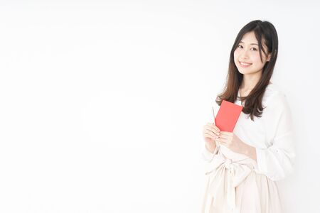 Young woman taking a noteの写真素材