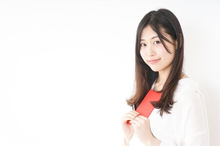 Young woman taking a noteの写真素材