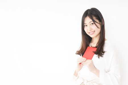 Young woman taking a noteの写真素材