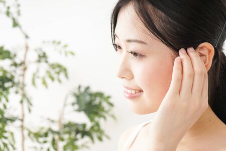 Young woman trussing the hairの写真素材