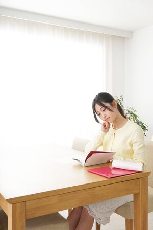 Young woman studying at homeの写真素材