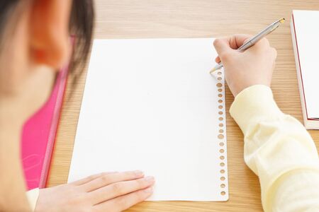 Young woman studying at homeの写真素材