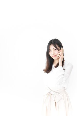 Young woman using smartphoneの写真素材