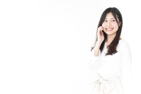 Young woman using smartphoneの写真素材