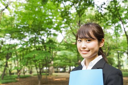 Young business woman holding documentsの写真素材
