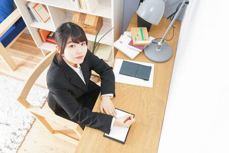 studying woman in suitの写真素材