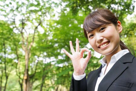 Young business woman saying OKの写真素材