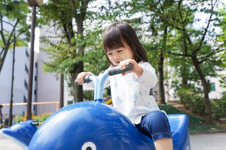 Child playing in the parkの写真素材