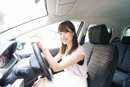 Young woman driving a carの写真素材