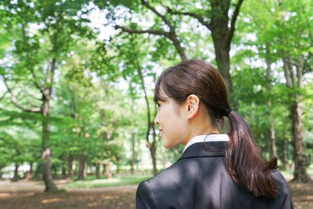 Young business woman smiling with suitの写真素材