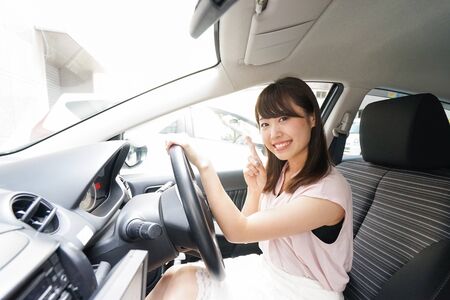 Young woman driving a carの写真素材