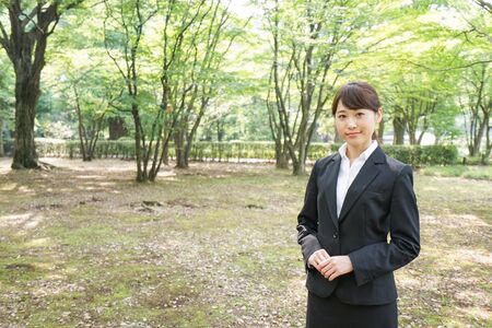 Young business woman smiling with suitの写真素材