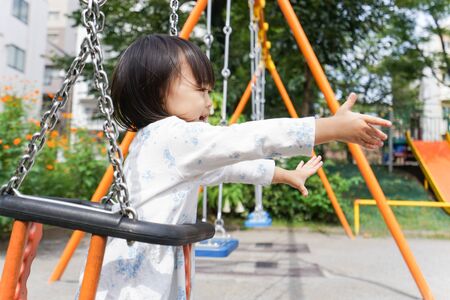 Child playing outsideの写真素材
