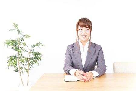 Business woman taking notesの写真素材
