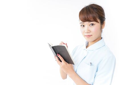 Nurse taking a memoの写真素材