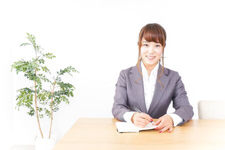 Business woman taking notesの写真素材
