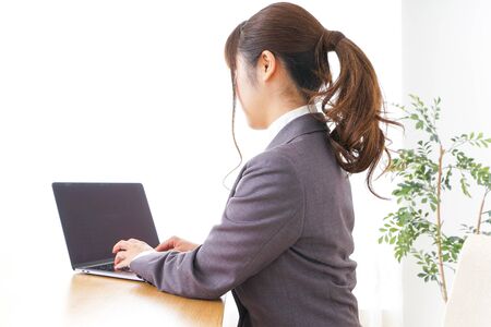 Business woman using a laptopの写真素材