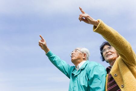 Senior couple poointing somethingの写真素材