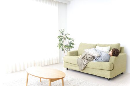 sleeping woman at homeの写真素材