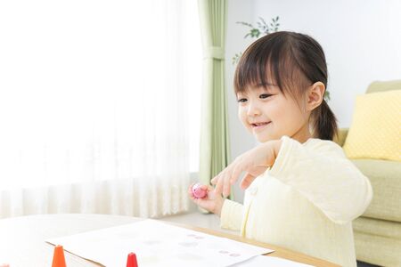 A child painting picturesの写真素材