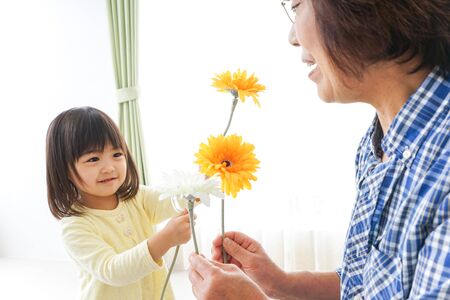 Child giving flowerの写真素材