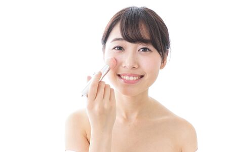 woman making herself upの写真素材