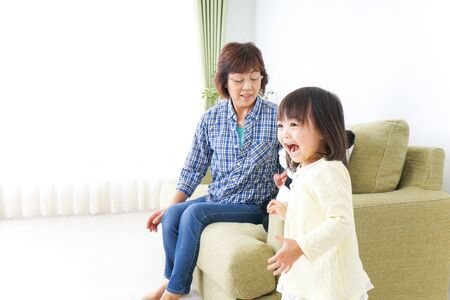 Child play with grandmotherの写真素材