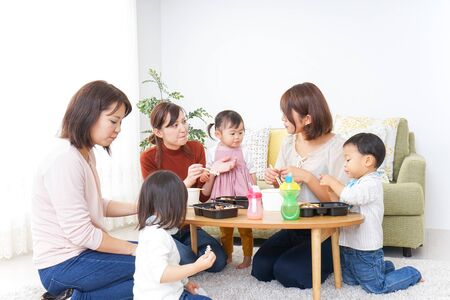 Mothers' friends and children doing party