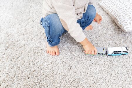 Boy playing train toysの写真素材