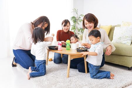 Mothers' friends and children doing partyの写真素材