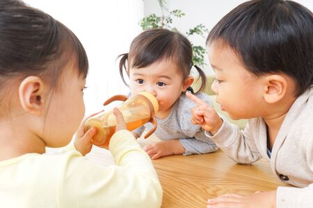 Children playing at homeの写真素材