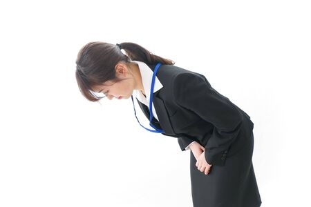 Business woman bowing to someoneの写真素材