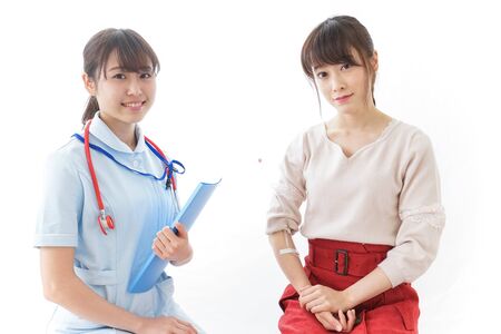 Woman receiving medical treatmentの写真素材