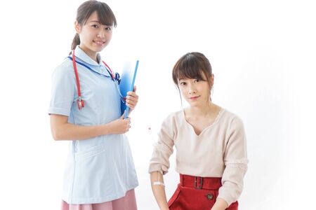 Woman receiving medical treatmentの写真素材