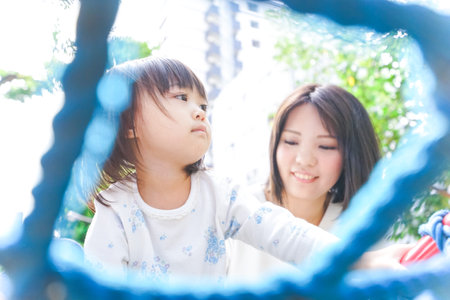 Child playing outsideの写真素材