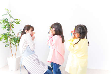 Mother and daughter doing activity together in the room high quality photoの写真素材
