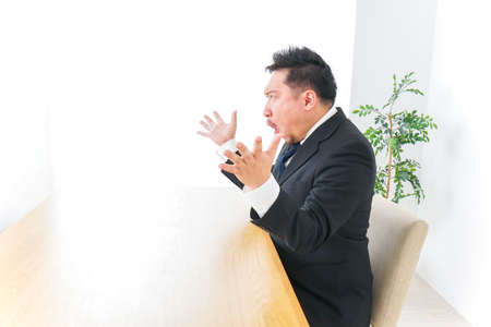 Surprising businessman imageの写真素材