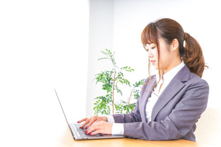 Business woman using a laptopの写真素材