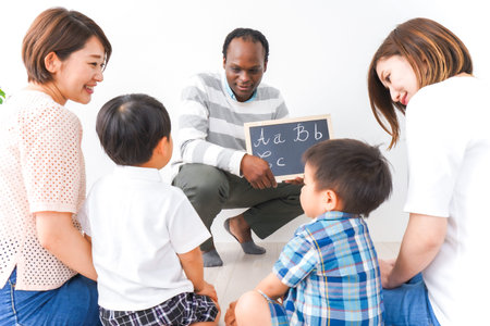 Happy family sitting on the floor in living room