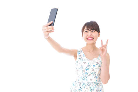 Young woman webcasting videoの写真素材