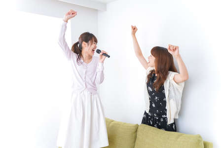 Young woman at Karaokeの写真素材