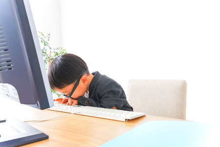 Child businessman working at officeの写真素材