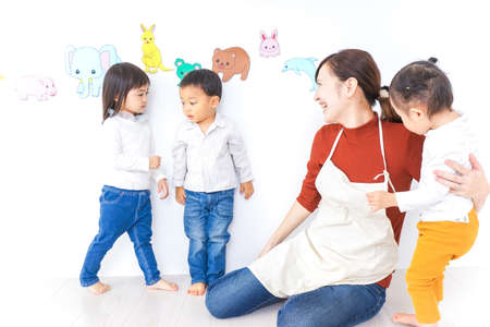 Children and teacher at Kindergartenの写真素材