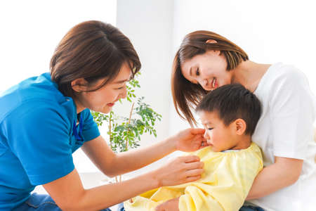 Mother and son playing in the living room at home. Happy family concept.の写真素材