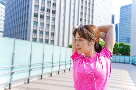 Woman stretching outsideの写真素材