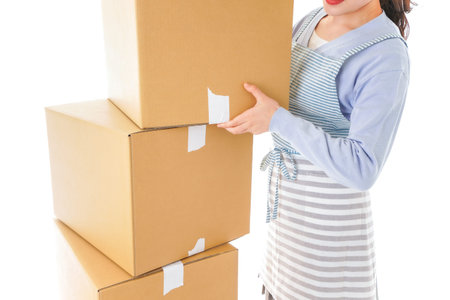 Woman holding cardboard boxes high angle view isolated on a white background.