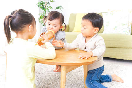 Children playing at homeの写真素材